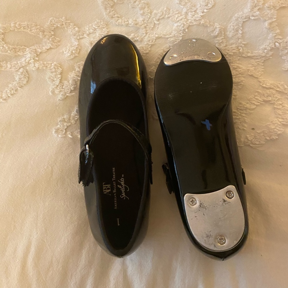 Little girl tap shoes.  Never worn.